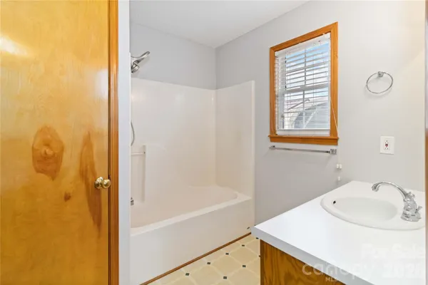 a bathroom with a sink and a bathtub