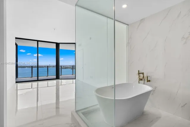 a bathroom with a sink a toilet and bathtub