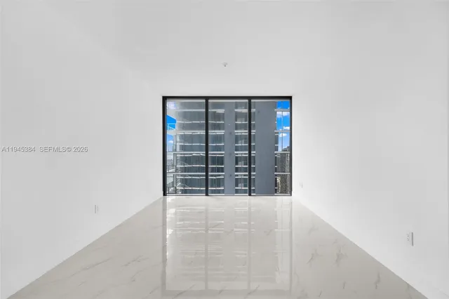 a kitchen with stainless steel appliances granite countertop a sink and a refrigerator