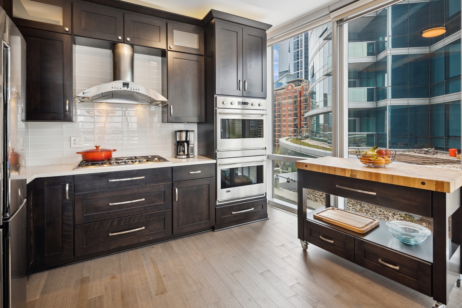 1211 South Prairie Avenue, Unit 606 Chicago, IL 60605 - Photo 11 of 44 a kitchen with stainless steel appliances a stove and a refrigerator