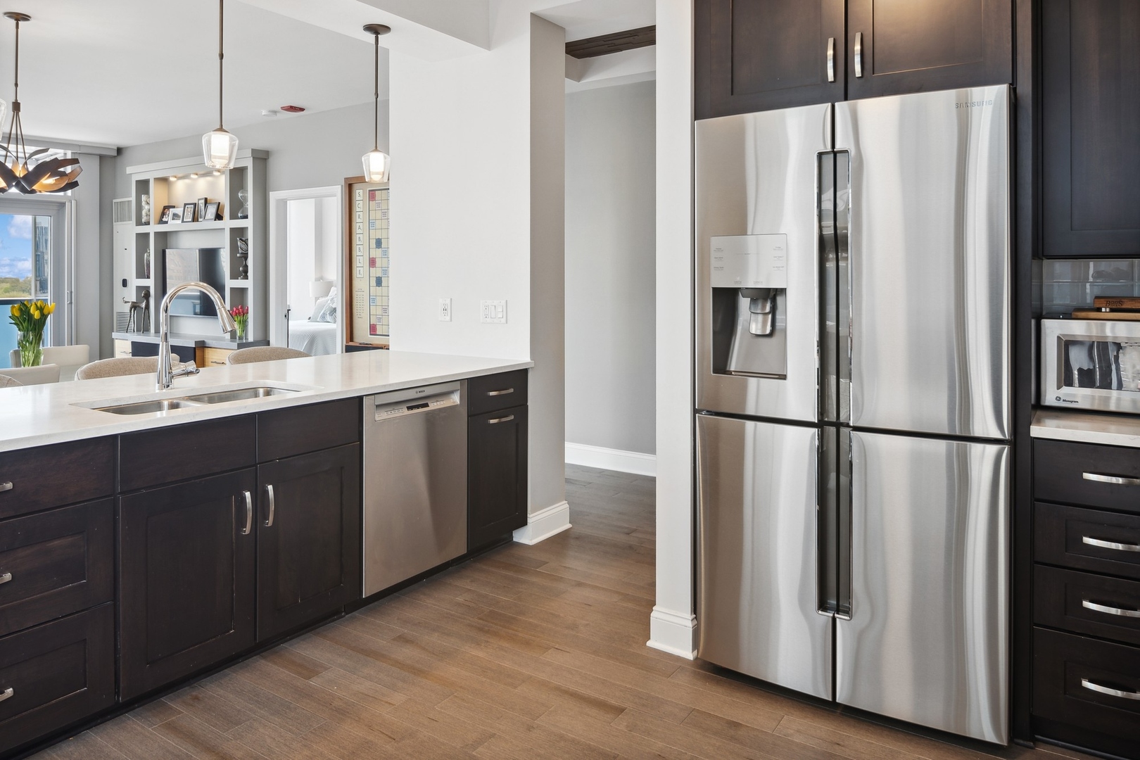 1211 South Prairie Avenue, Unit 606 Chicago, IL 60605 - Photo 13 of 44 a kitchen with kitchen island a counter top space wooden floor and appliances