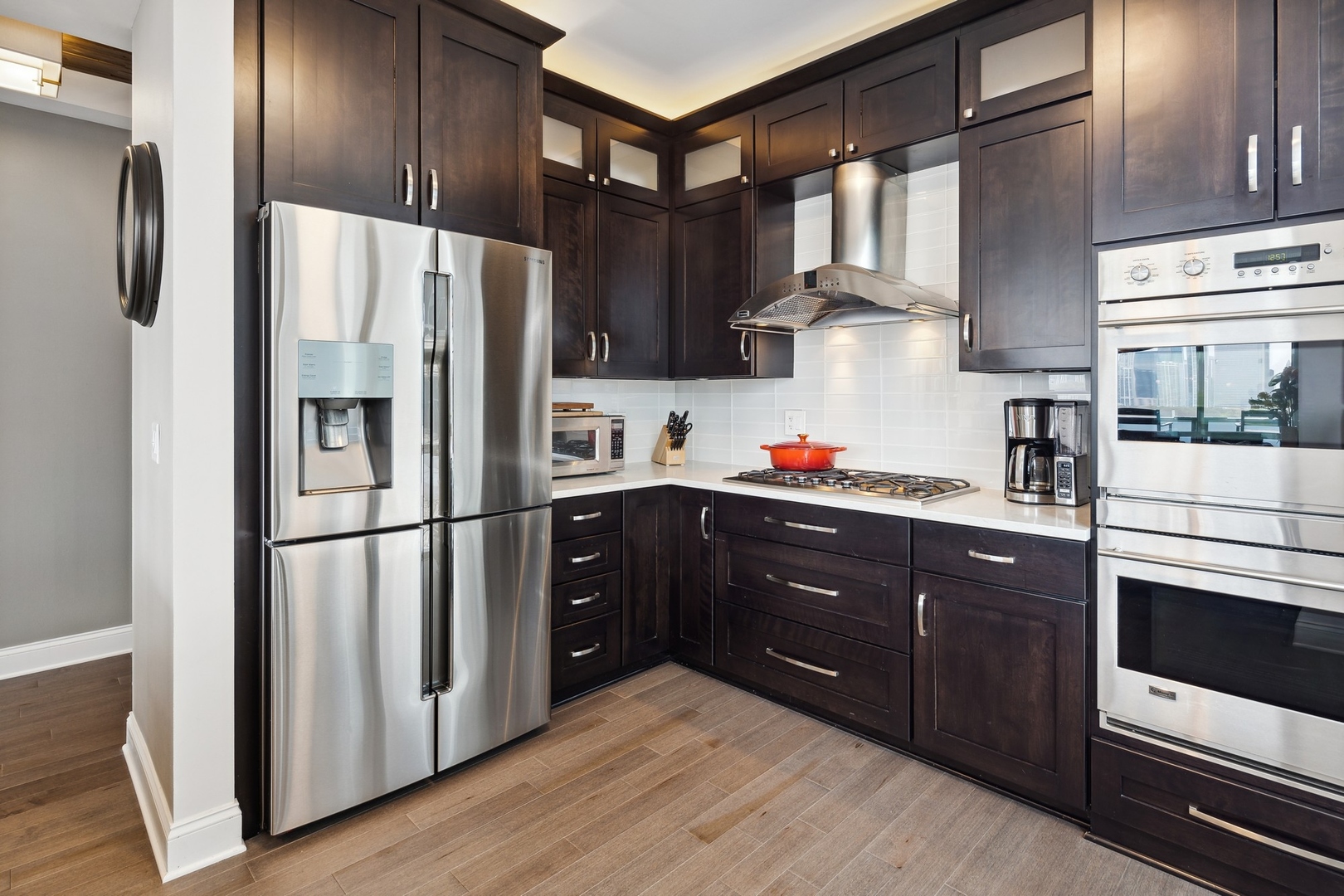 1211 South Prairie Avenue, Unit 606 Chicago, IL 60605 - Photo 14 of 44 a kitchen with stainless steel appliances granite countertop a refrigerator and a stove