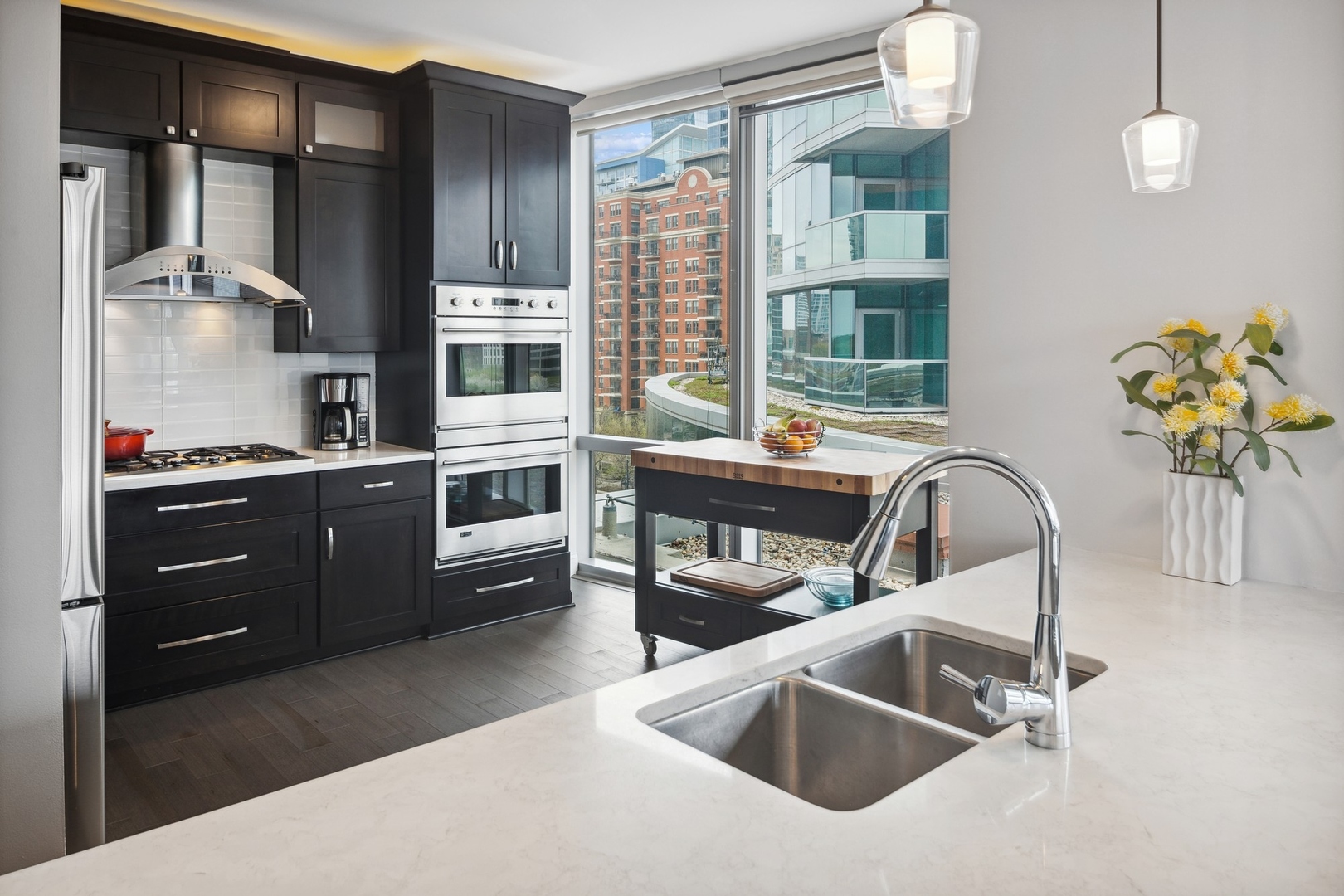 1211 South Prairie Avenue, Unit 606 Chicago, IL 60605 - Photo 15 of 44 a kitchen with stainless steel appliances a sink a stove and a refrigerator