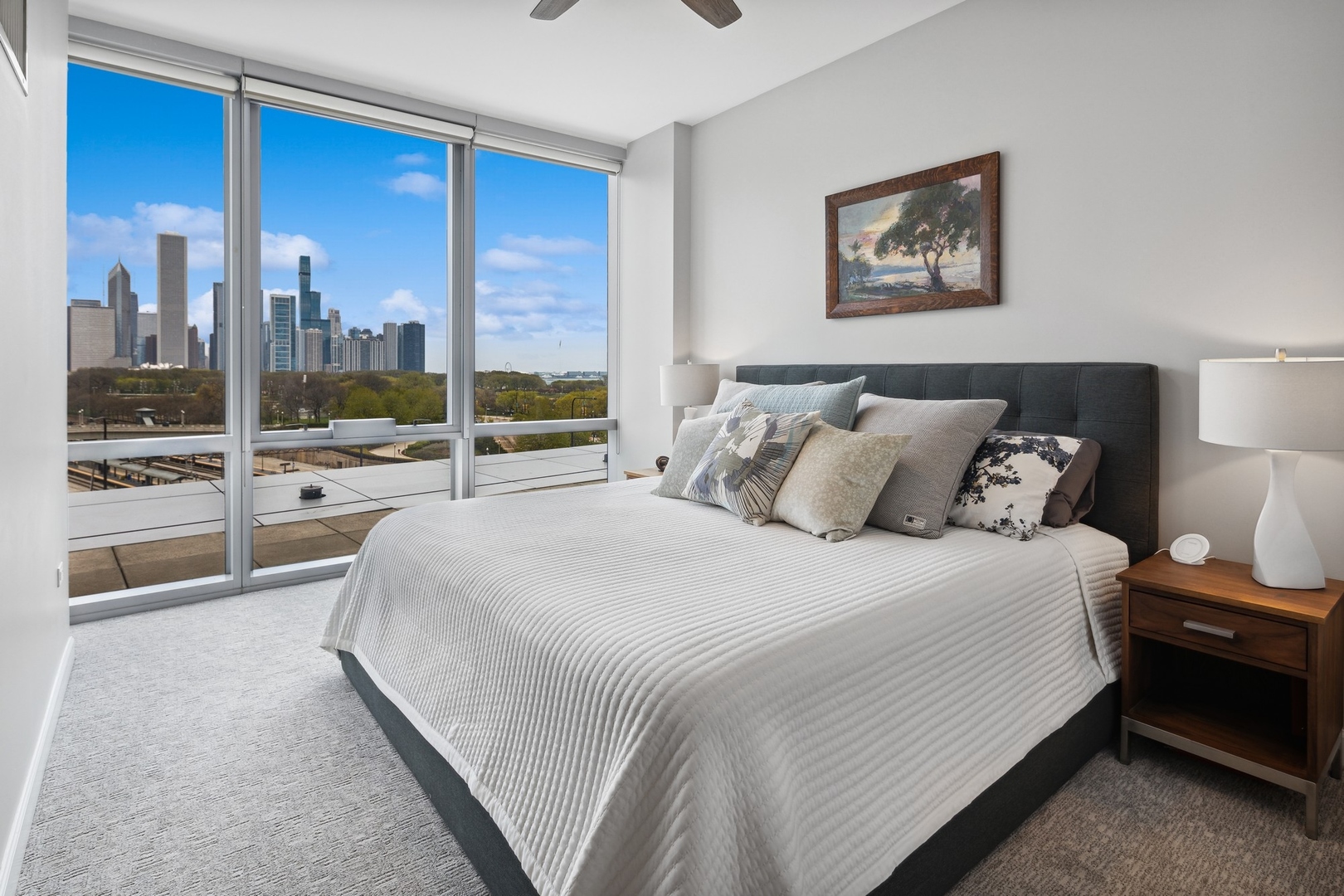 1211 South Prairie Avenue, Unit 606 Chicago, IL 60605 - Photo 16 of 44 a spacious bedroom with a bed and a large window
