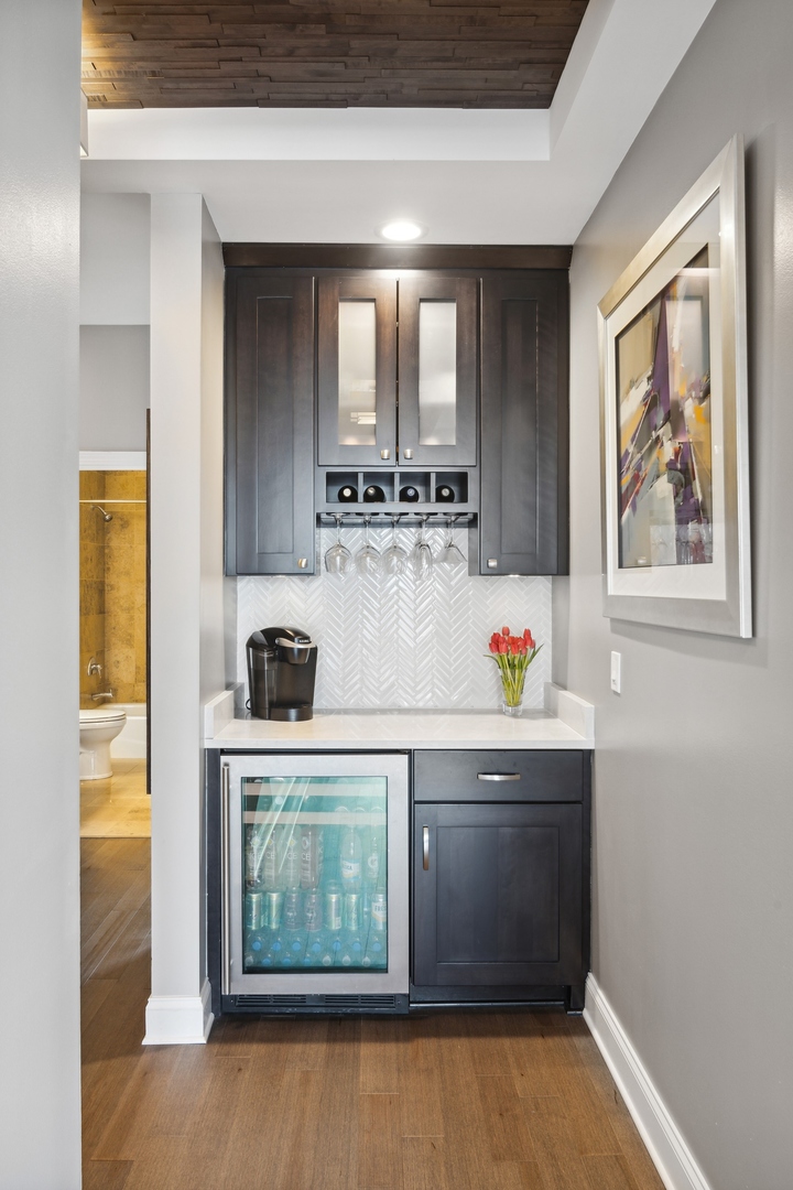 1211 South Prairie Avenue, Unit 606 Chicago, IL 60605 - Photo 22 of 44 a kitchen with stainless steel appliances a stove and white cabinets
