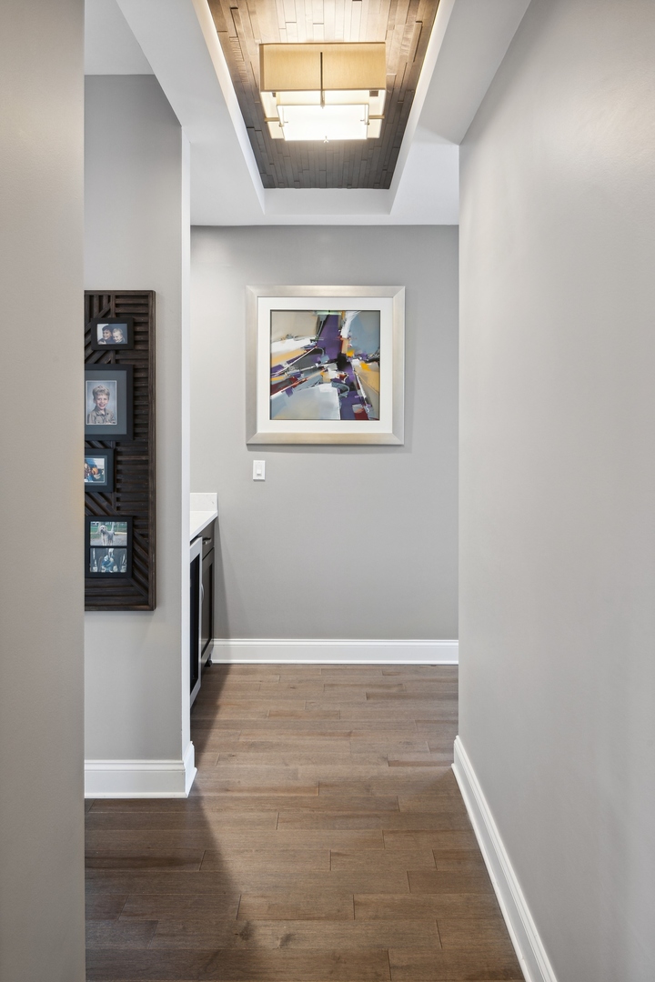 1211 South Prairie Avenue, Unit 606 Chicago, IL 60605 - Photo 23 of 44 an empty room with wooden floor and windows