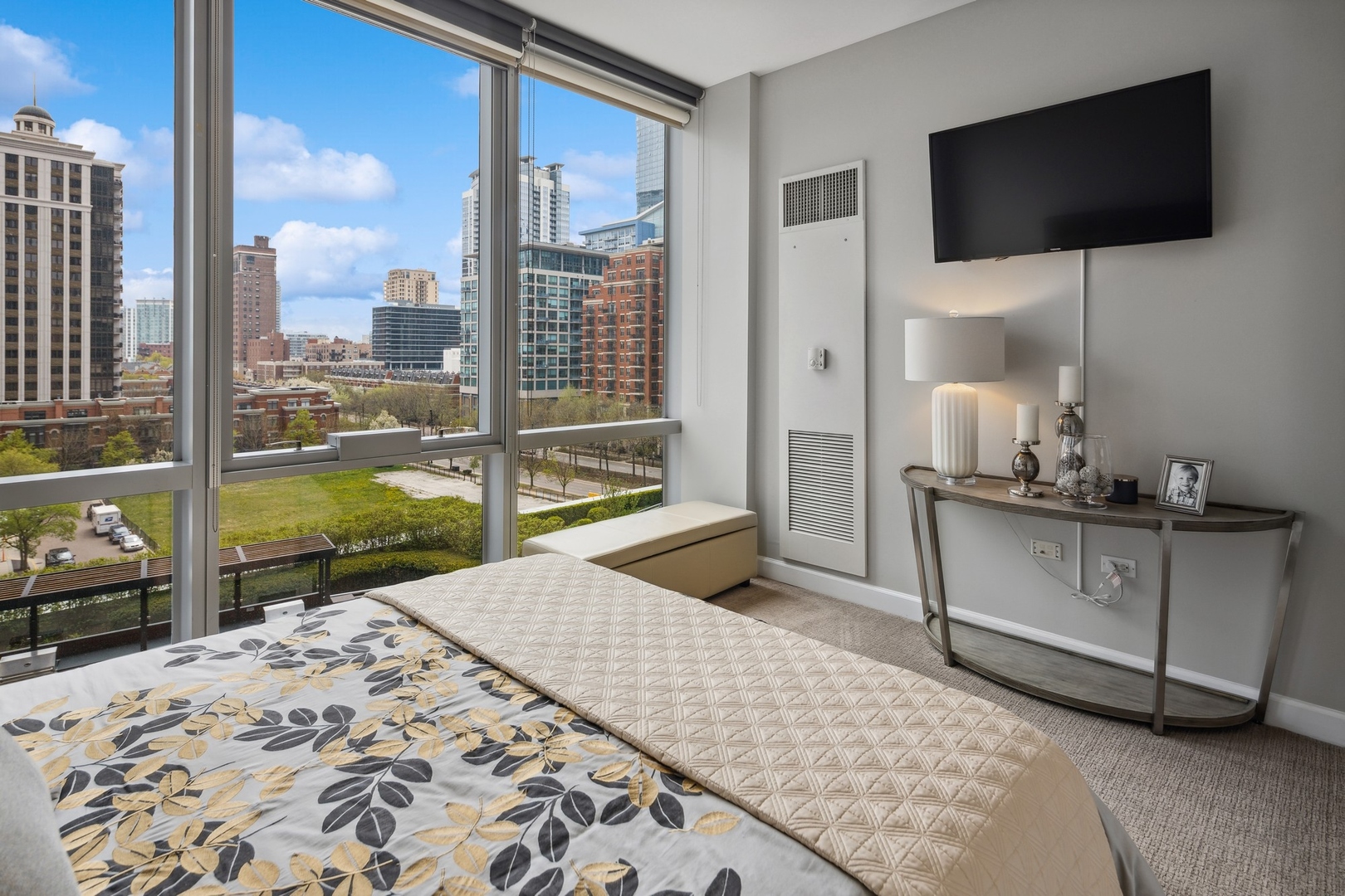 1211 South Prairie Avenue, Unit 606 Chicago, IL 60605 - Photo 30 of 44 a living room with a flat screen tv and a floor to ceiling window