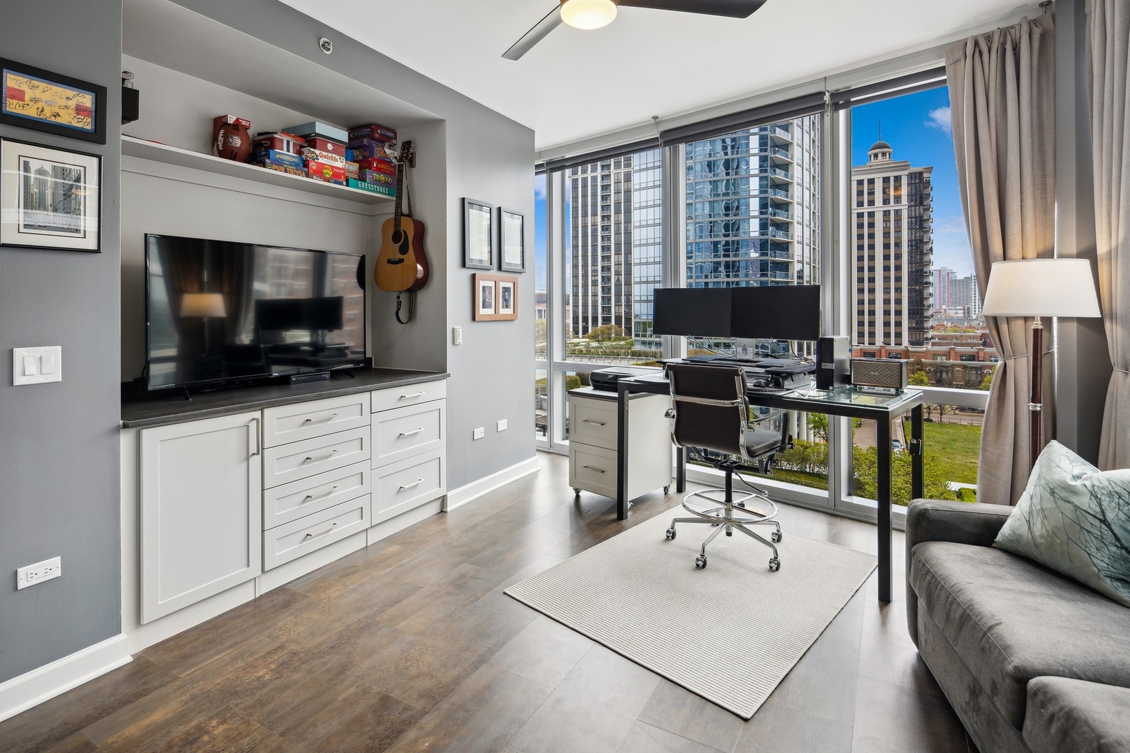1211 South Prairie Avenue, Unit 606 Chicago, IL 60605 - Photo 33 of 44 a living room with furniture and a flat screen tv