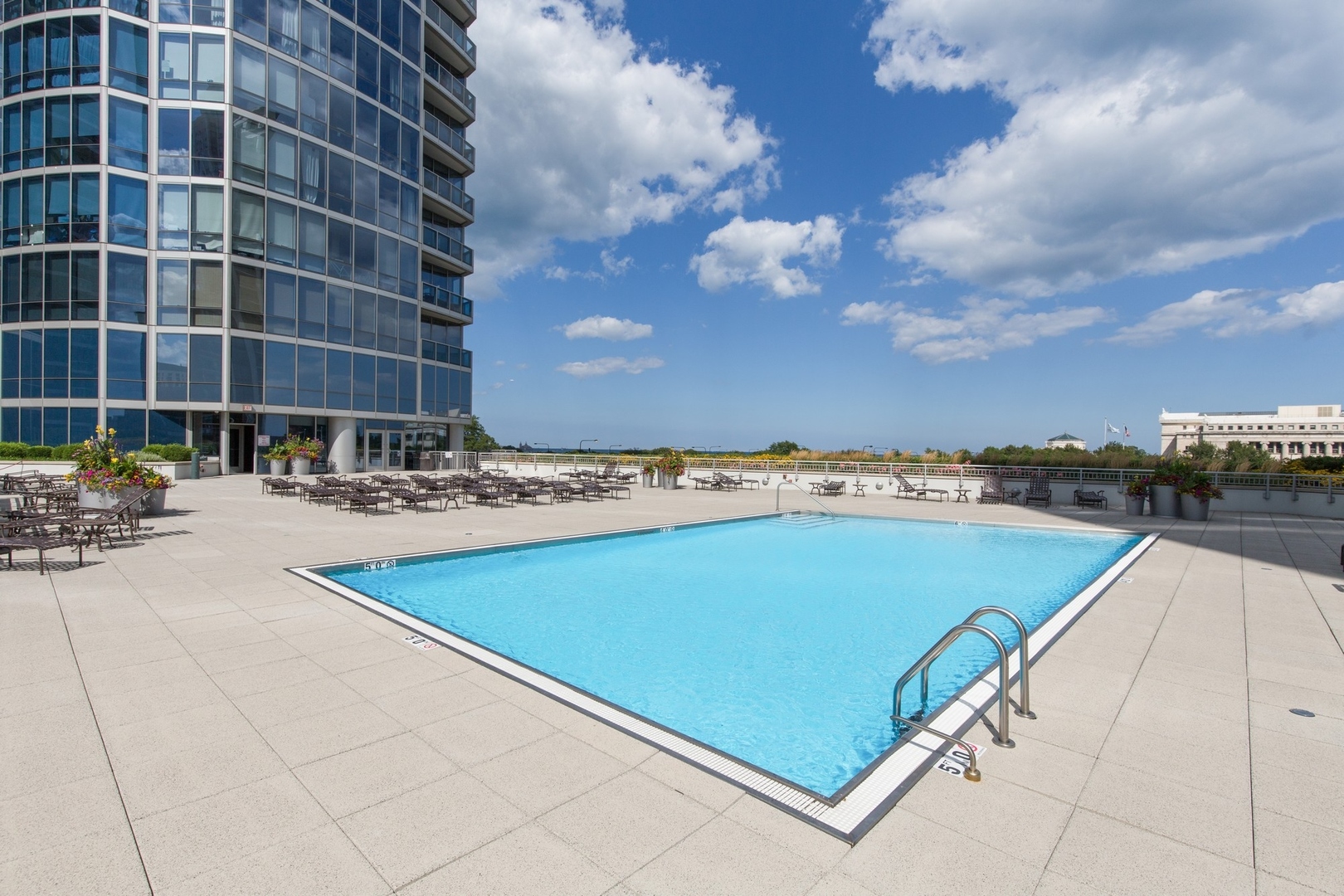 1211 South Prairie Avenue, Unit 606 Chicago, IL 60605 - Photo 42 of 44 a view of swimming pool with outdoor seating and city view