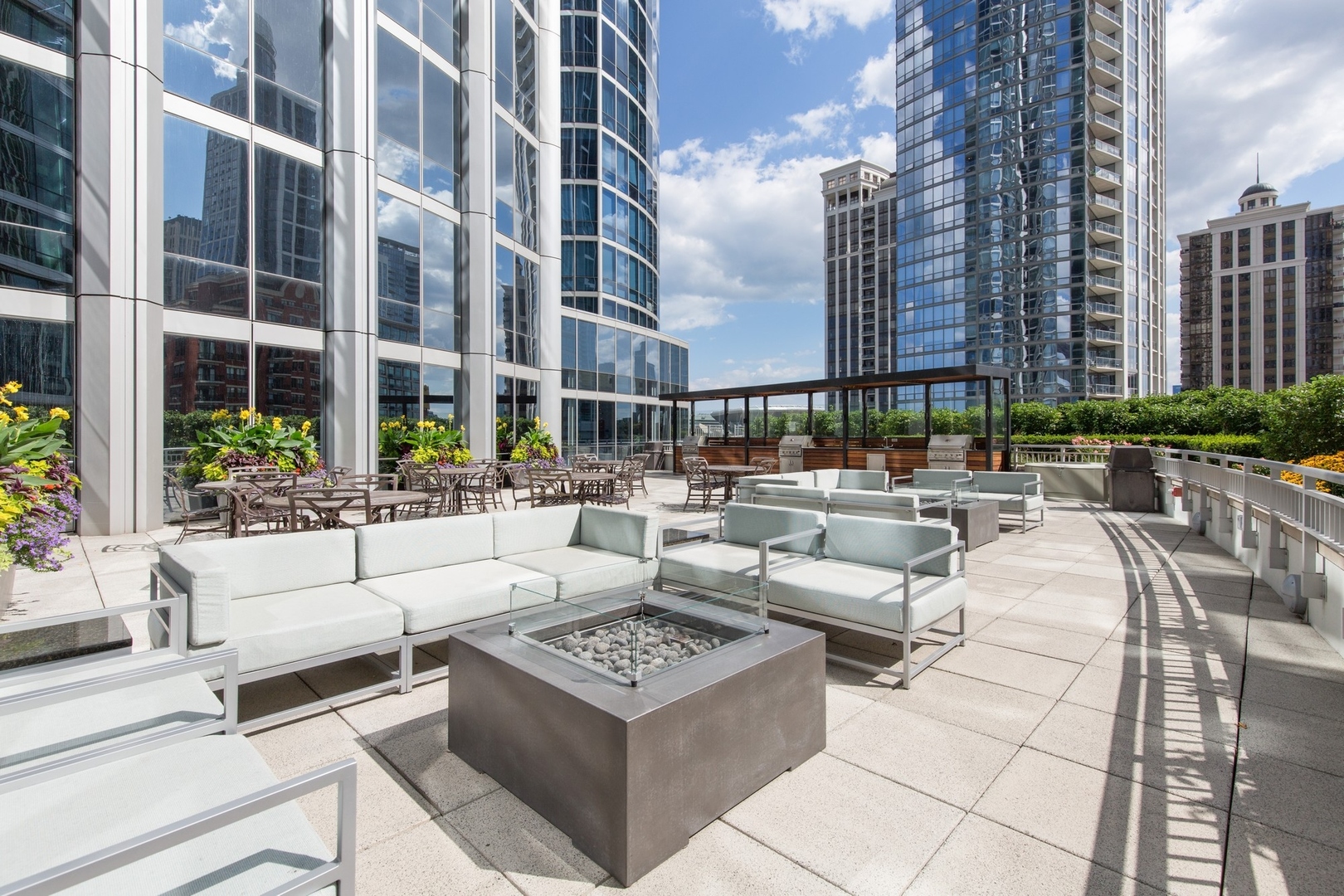 1211 South Prairie Avenue, Unit 606 Chicago, IL 60605 - Photo 43 of 44 a view of a patio with couches and a potted plant on a table