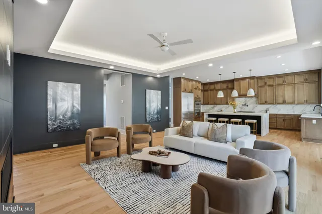 a kitchen with granite countertop a sink a counter space cabinets and stainless steel appliances