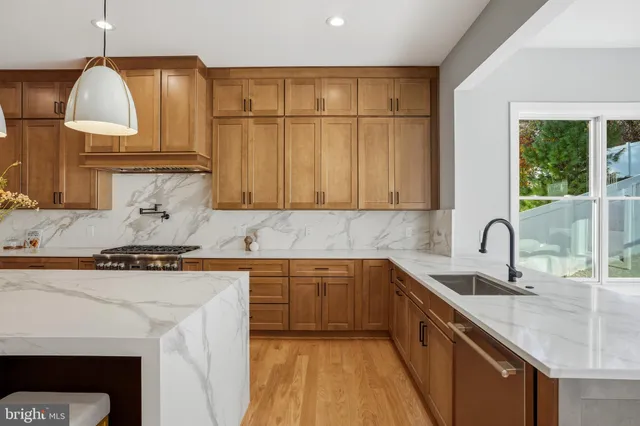 a spacious bedroom with a bed and a large window