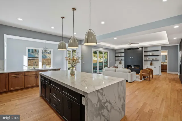a white bath tub sitting next to a toilet