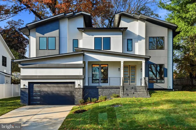 front view of a house with a tree