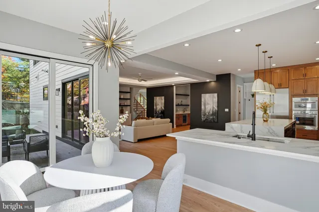 a bathroom with a toilet sink vanity and shower
