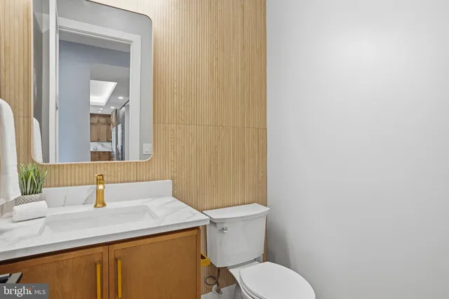 a view of a room with wooden floor and a window