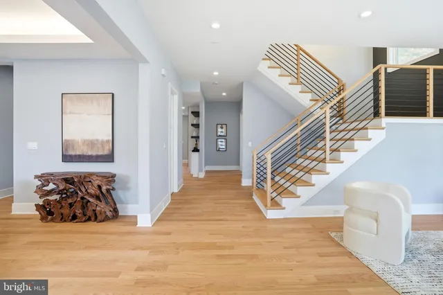 a kitchen with a sink and a wooden floor