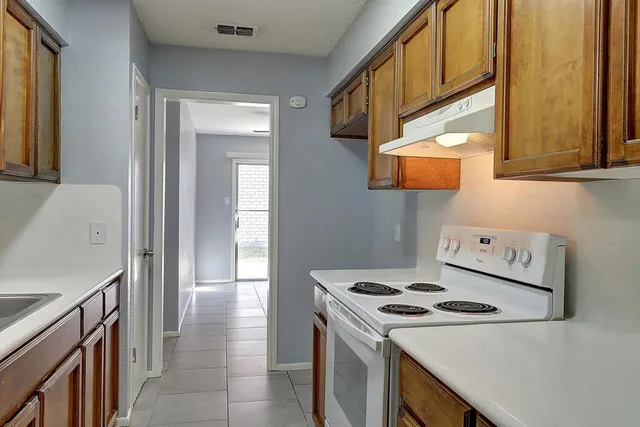 a kitchen with a stove and a microwave