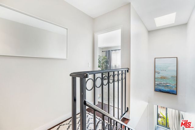 a bathroom with a sink mirror and toilet