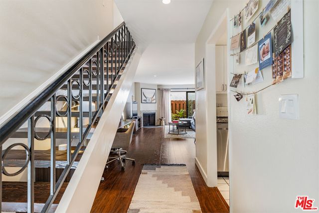 a living room with furniture fireplace and a flat screen tv