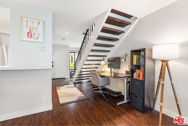 a room with furniture and a potted plant
