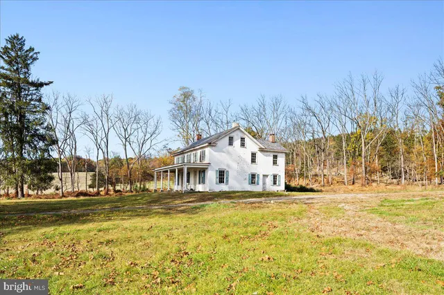 a front view of a building with a yard
