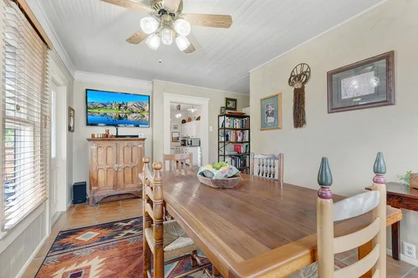 a dining room with furniture and window
