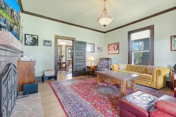 a living room with furniture and a rug