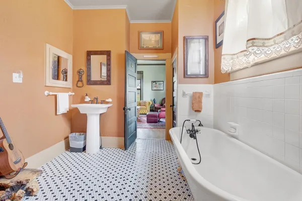 a bathroom with a bathtub and a toilet