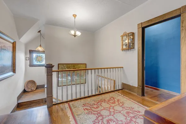 a view of a livingroom with furniture and hardwood floor