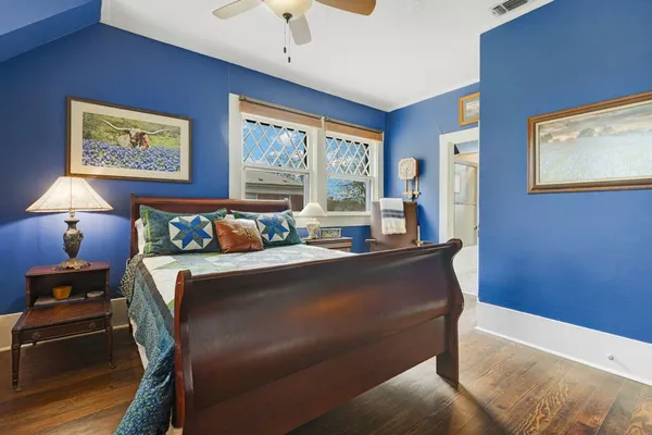 a bed room with a bed and a lamp