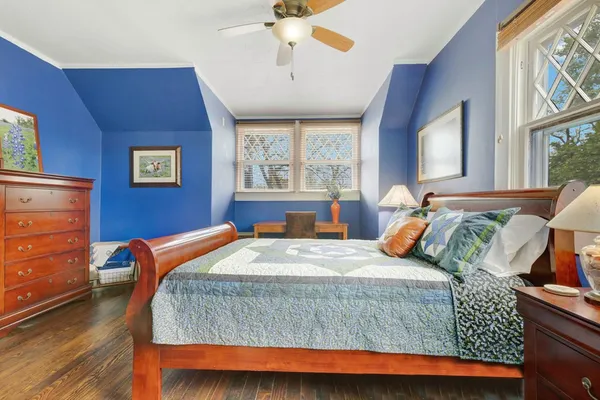 a bedroom with a bed and window