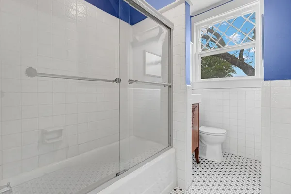 a bathroom with a bathtub and a toilet