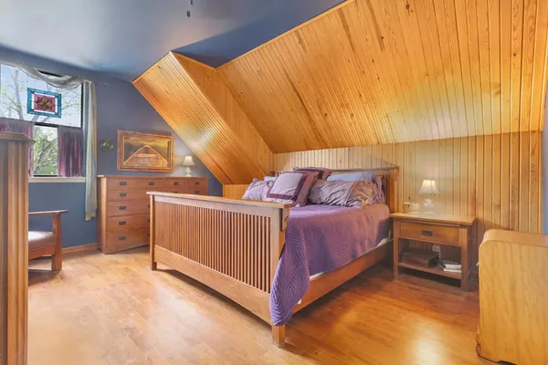 a bedroom with a bed and a table