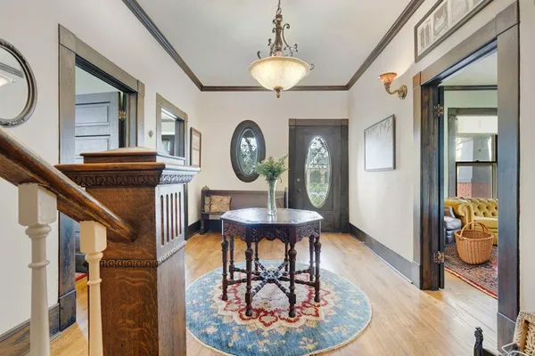 a view of a hallway with seating area