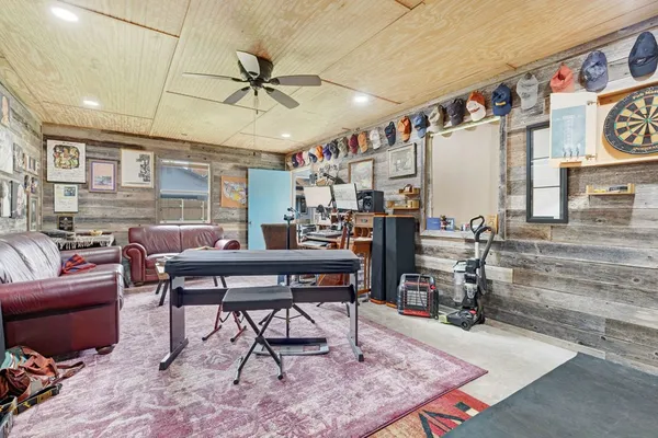 a work room with furniture and a rug