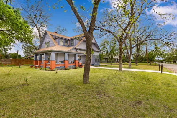 a view of a building with a yard