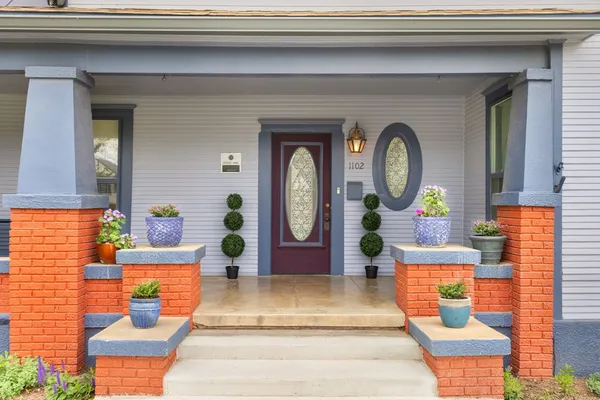 a front view of a house with garden