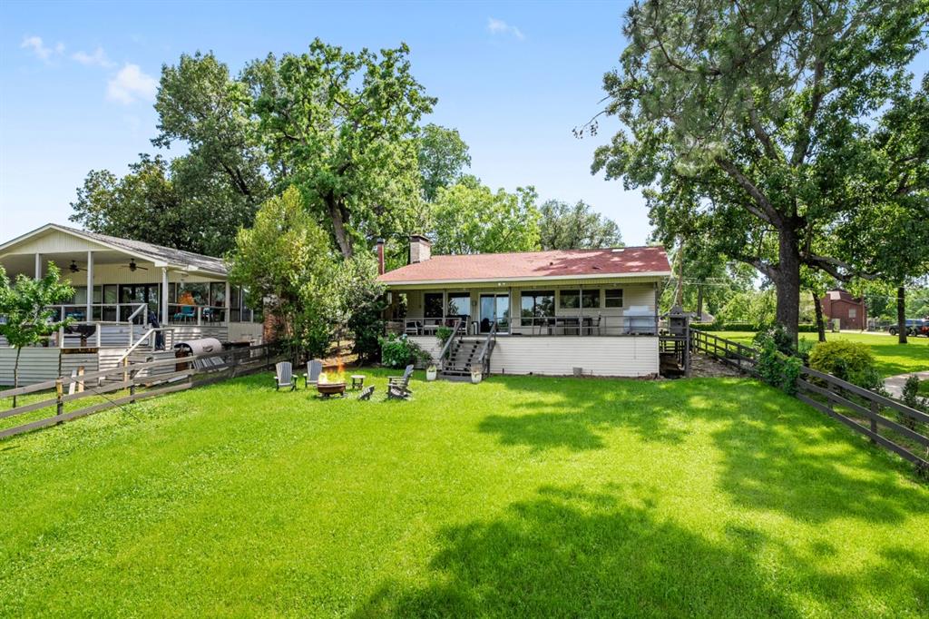 111 Ridgeoak Way Tool, TX 75143 - Photo 23 of 24 a view of a house with a yard patio and sitting area