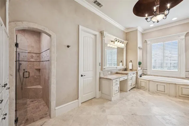 a large white bathroom with a granite countertop sink mirror and bathtub