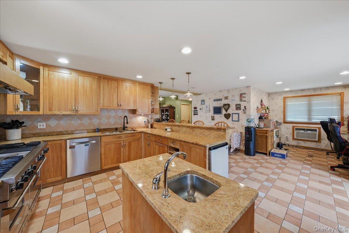 47-23 164th Street Queens, NY 11358 - Photo 16 of 47 a kitchen with stainless steel appliances granite countertop a sink stove and refrigerator