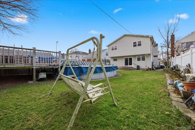 a view of a house with backyard and a slide