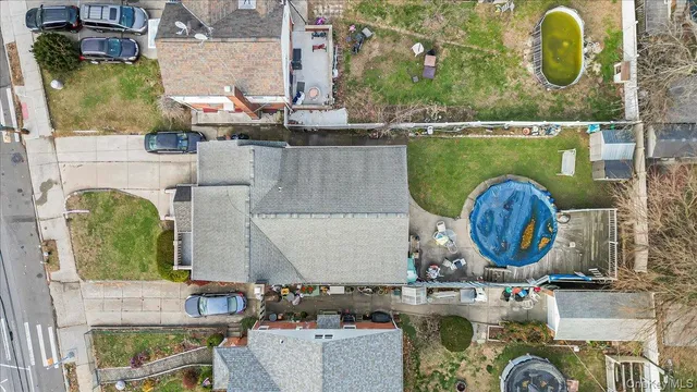 an aerial view of a house with swimming pool