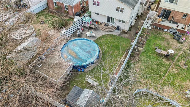 an aerial view of a house with outdoor space