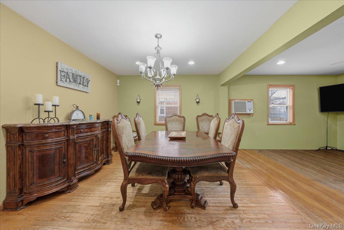 47-23 164th Street Queens, NY 11358 - Photo 8 of 47 a view of a dining room with furniture and wooden floor