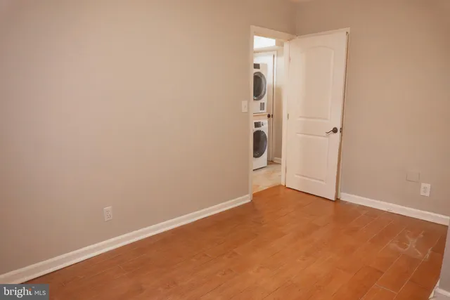 an empty room with wooden door