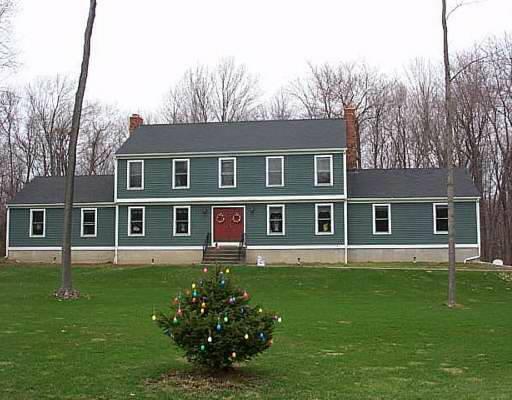 14 Poor House Road Newtown, CT 06470 - Photo 1 of 1 a front view of house with yard and green space