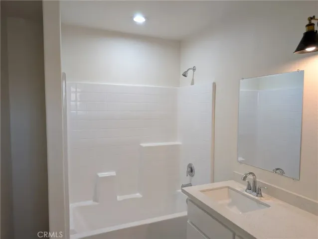 a bathroom with a sink and a bathtub