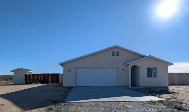 a front view of a house with yard