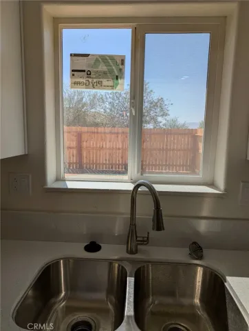 a bathroom with a sink and a window